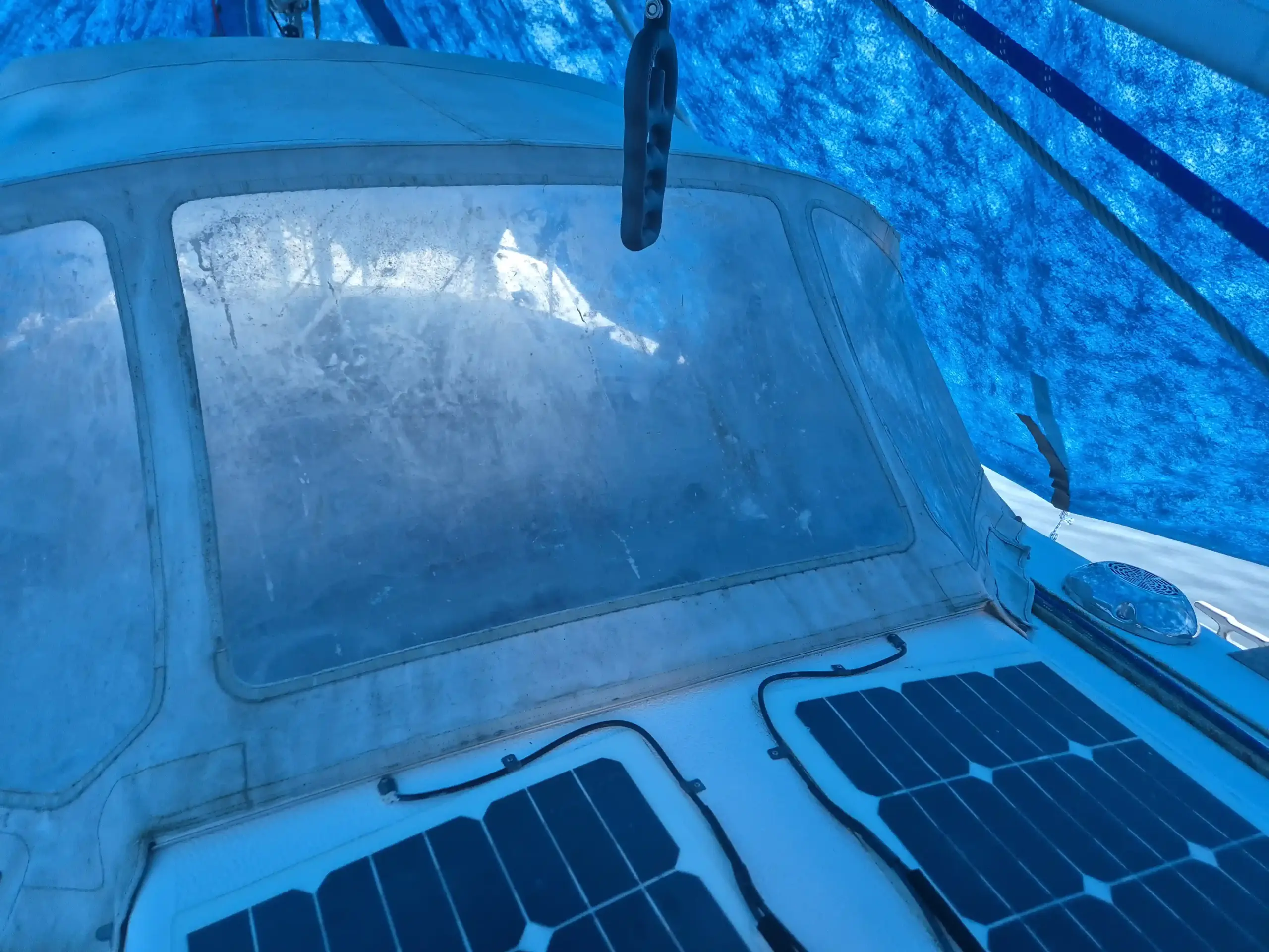 Worn original sprayhood for Omega 36 before renovation with discolored acrylic window