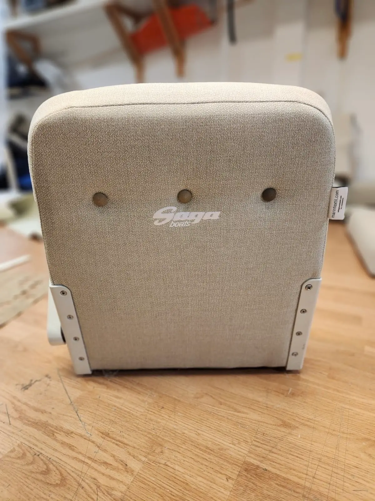 Saga 315 boat cushions beige upholstery in Marstrands Marintextil workshop in Gothenburg - customized seat cushions boat