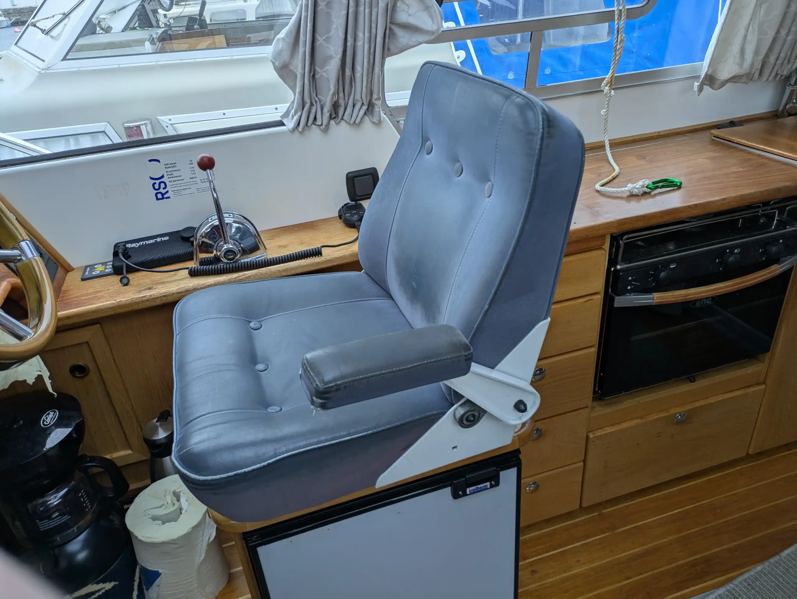 Seat cushion in Saga 315 before reupholstery - worn boat cushions in saloon before renovation and new upholstery in Gothenburg