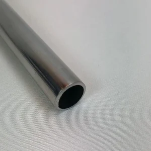 Close-up of the round opening in a polished stainless steel pipe